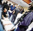  Cuatro detenidos por robo de 215 pistolas. La Policía judicial recuperó 17 pistolas robadas al Tránsito durante allanamientos hechos en Alajuelita el 3 de febrero. Archivo.