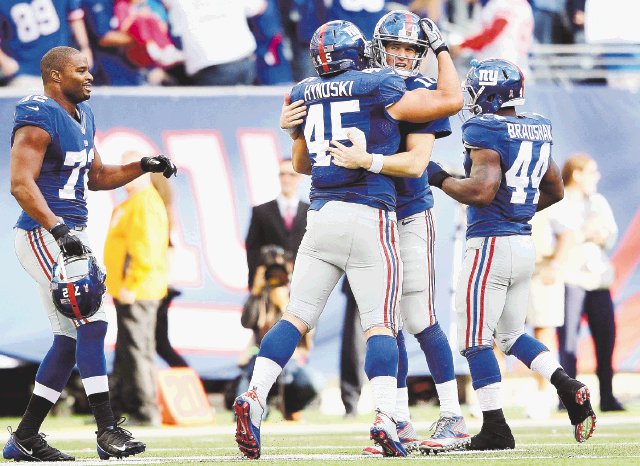  Manning imparable en la NFL. Los Giants festejan su victoria 27-23 ante los Redskins.AFP